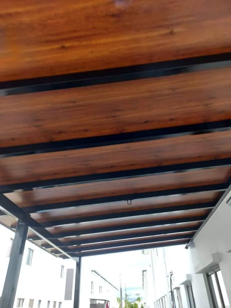 Wood grain ACP awning seen from below