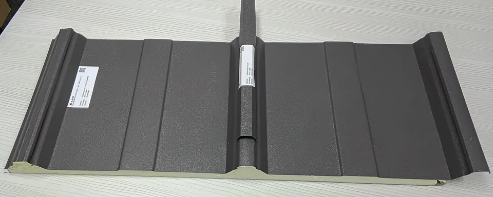 Insulated metal deck panel with a PU foam layer