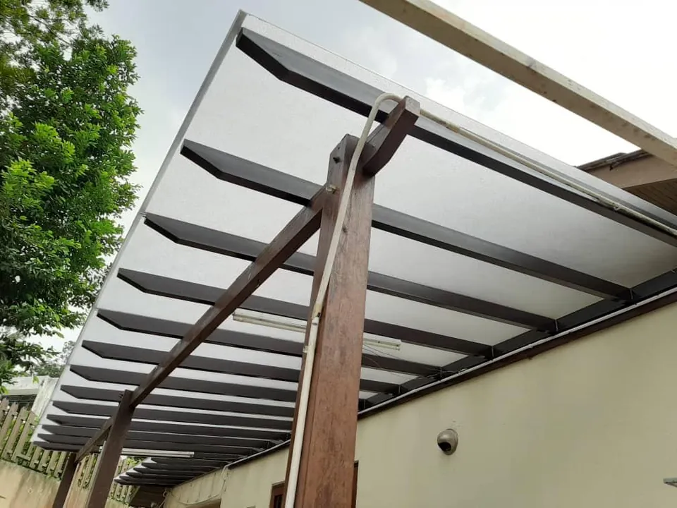 Polycarbonate pergola roof on a timber frame