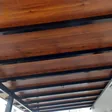 Wood grain ACP awning seen from below