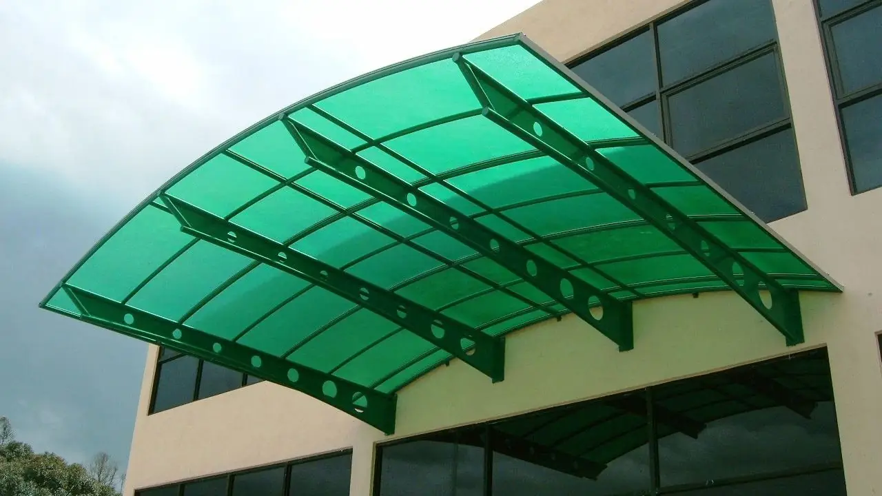 Curved green polycarbonate canopy on a building